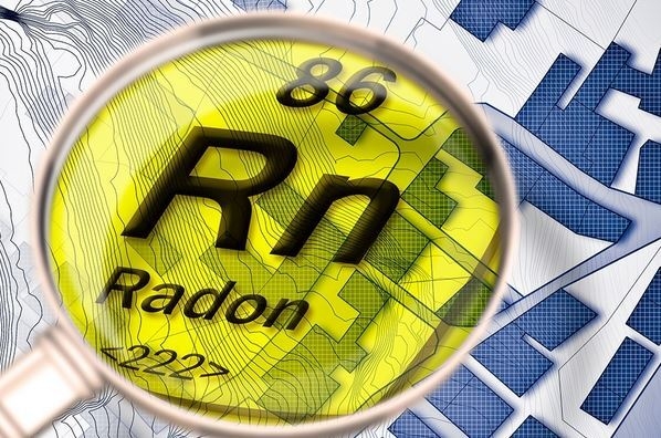 Lupe zeigt chemisches Zeichen für Radon "Rn"